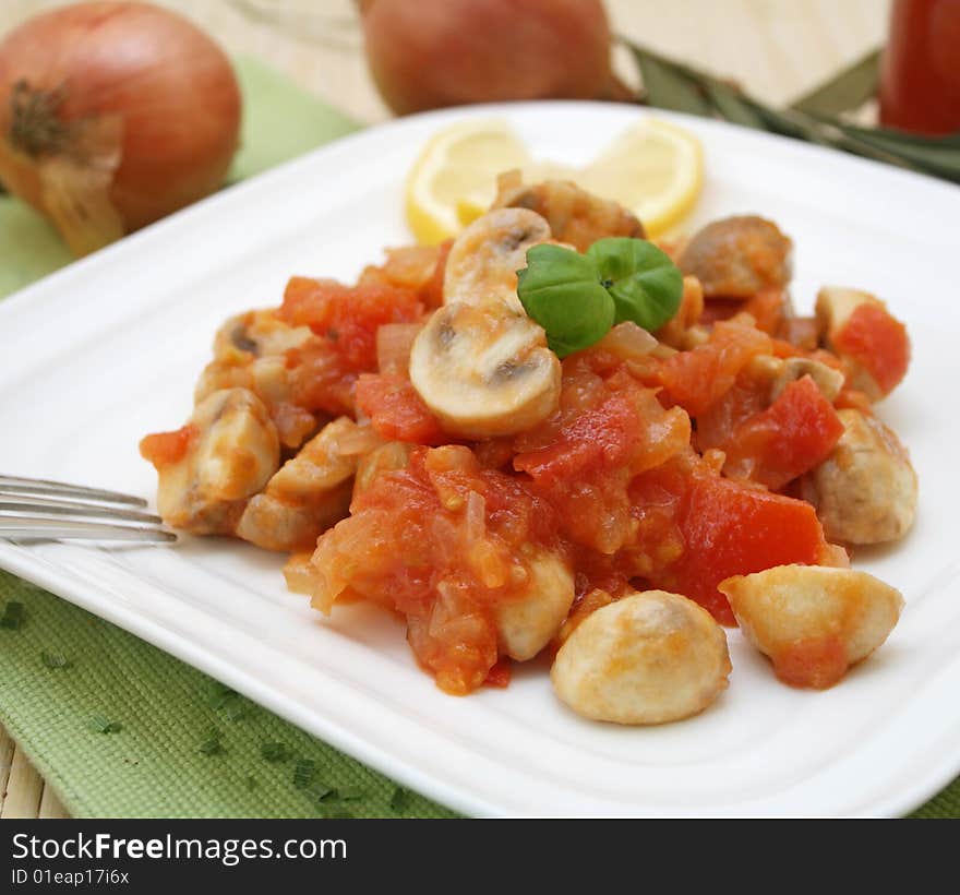 A fresh meal of mushrooms with tomatoes and spices. A fresh meal of mushrooms with tomatoes and spices