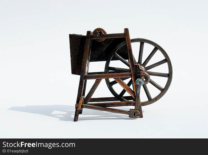 Old bronze machine on white background, metal structure. Old bronze machine on white background, metal structure