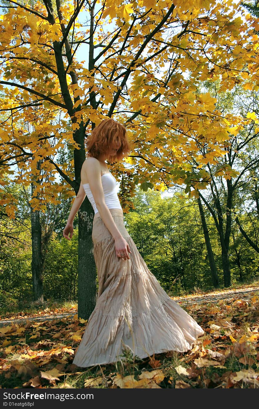 Young woman in an autumn park