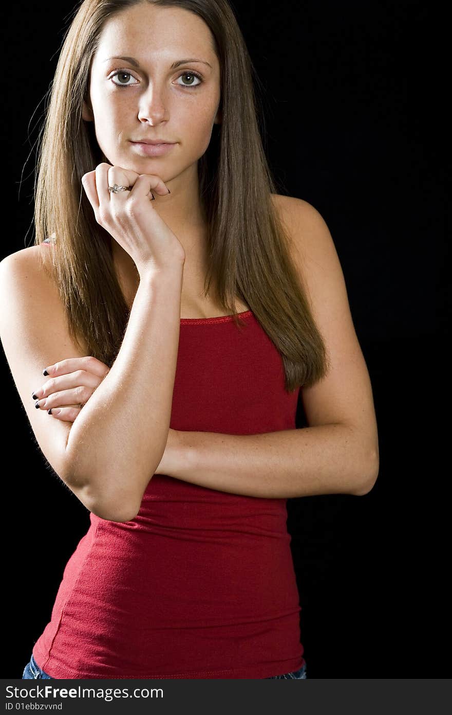 Standing pose from model.  She is wearing a form fitted red tank. Standing pose from model.  She is wearing a form fitted red tank.