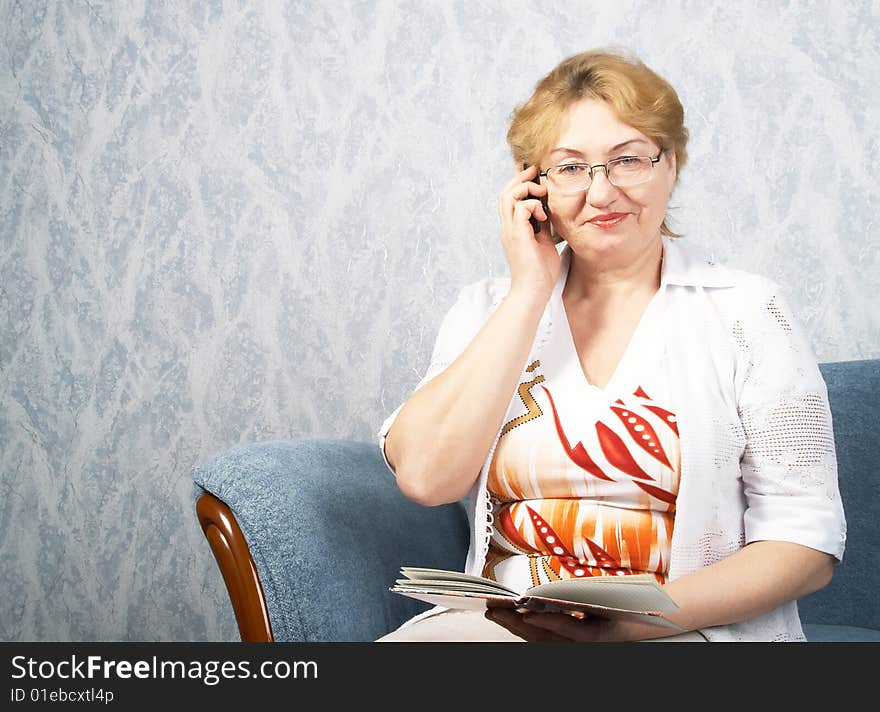 The mature woman with phone