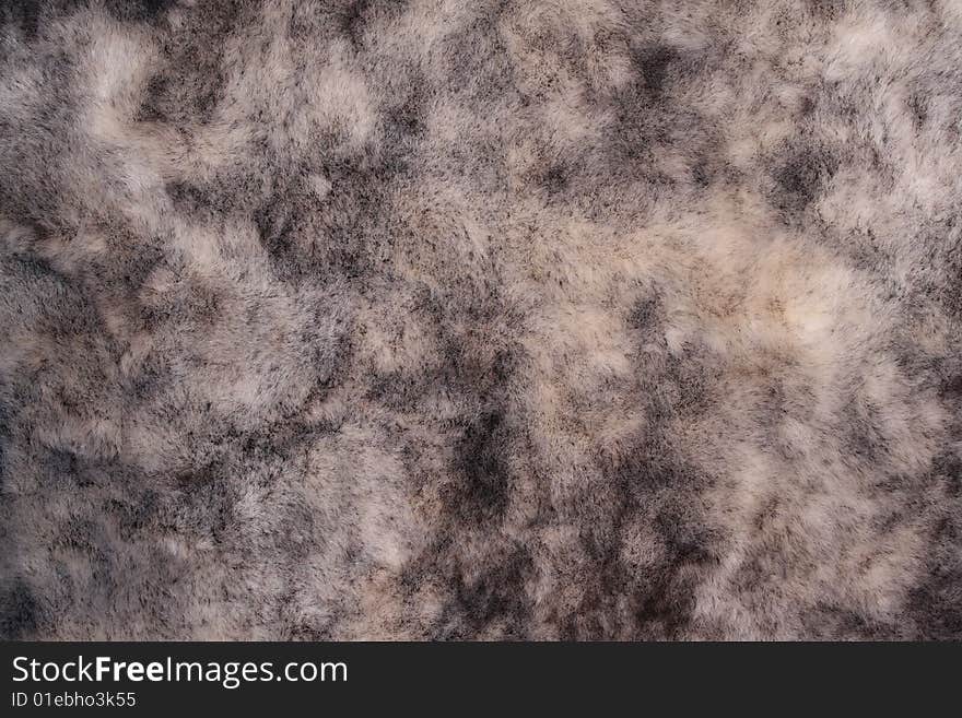 Impressive background from natural fur of grey color in divorces