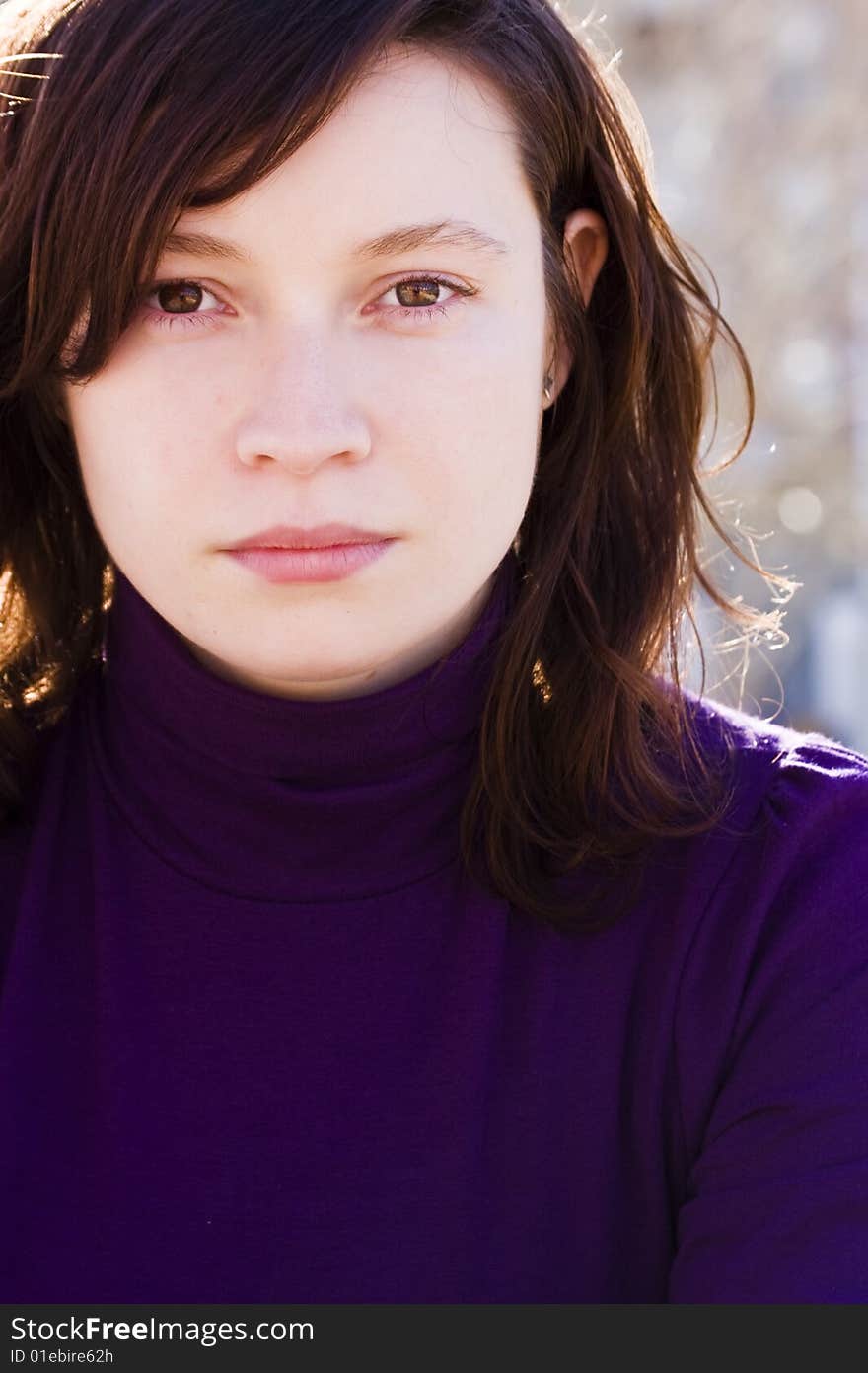 Young caucasian woman portrait staring at camera.