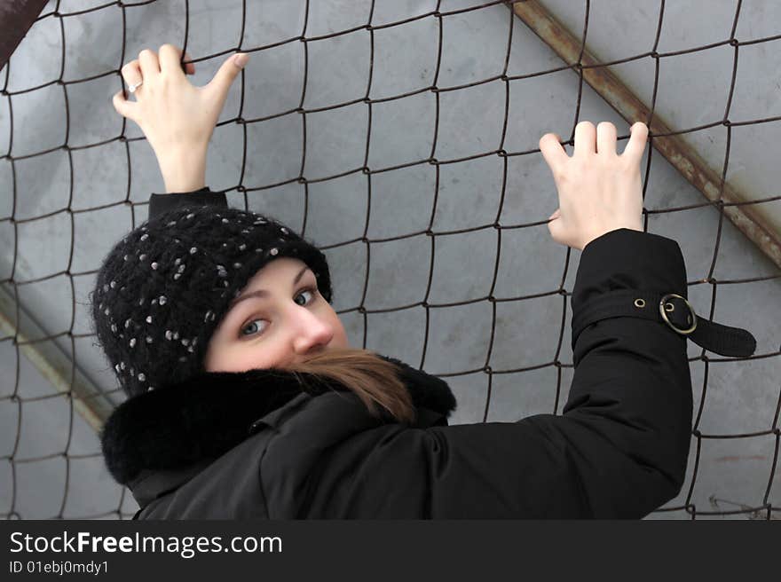 Girl climbs a net