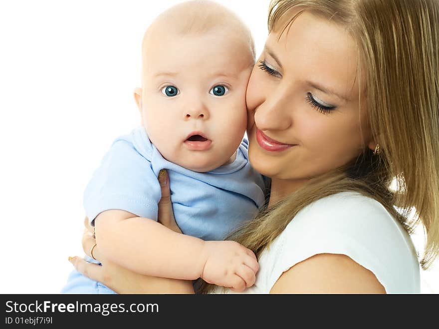 Young beautiful mother embracing her little baby and smiling. Young beautiful mother embracing her little baby and smiling