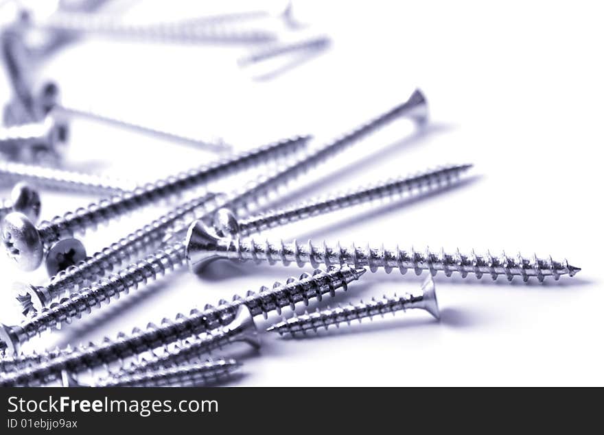 Metal screws closeup on white background