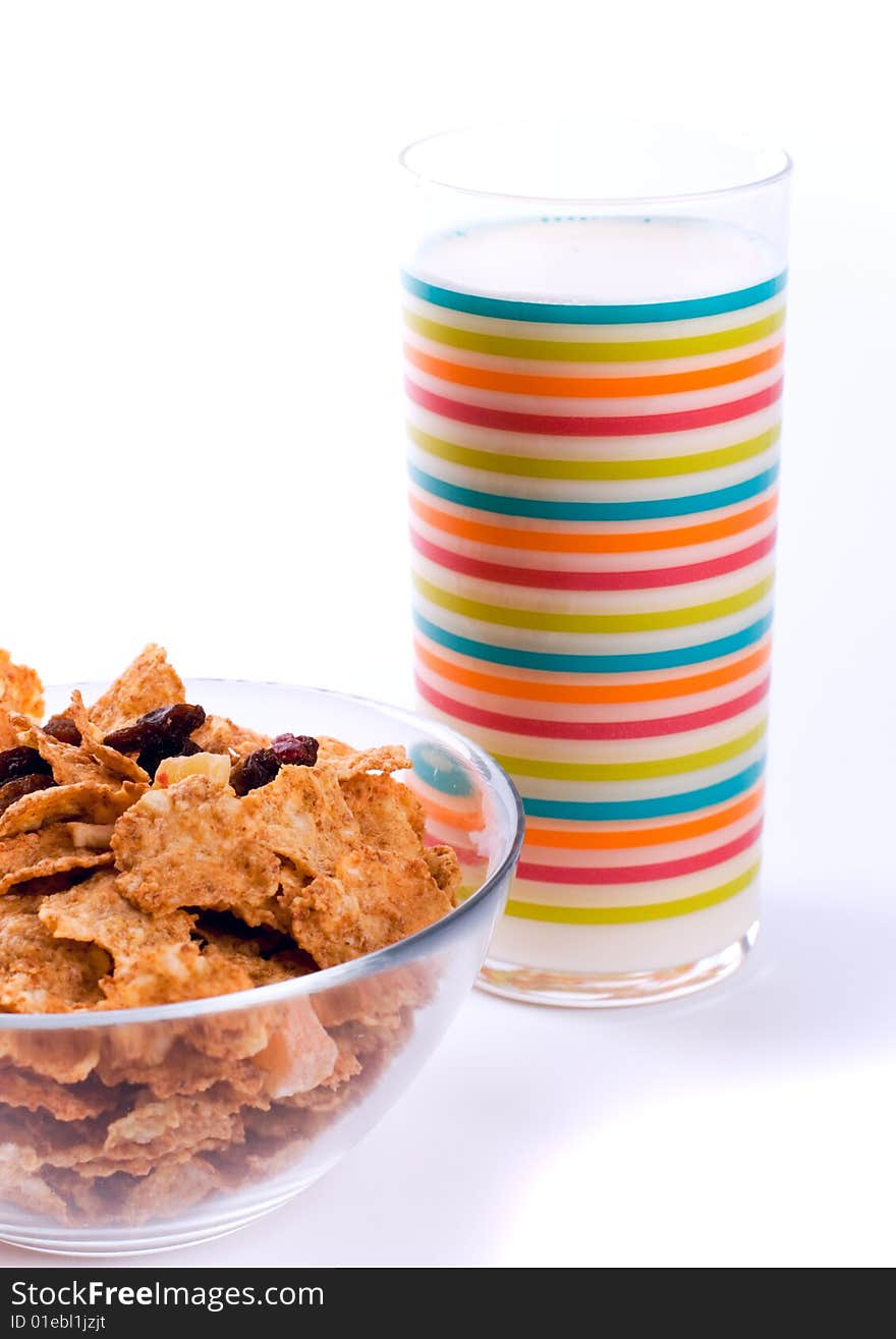 Bowl with cornflakes and glass of milk