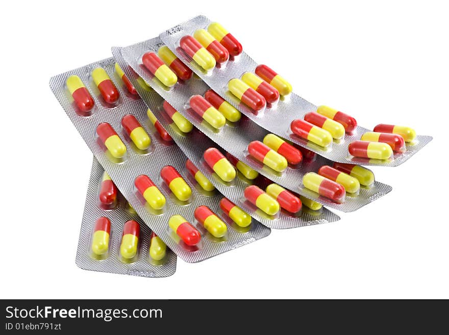 Red and yellow paks of pills isolated