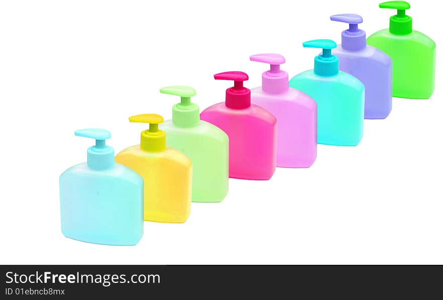 Lots of colourful bottles of handwash on white. Lots of colourful bottles of handwash on white