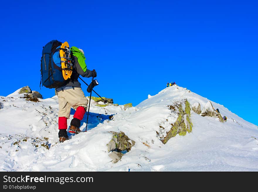 Hiker are in winter in mountains