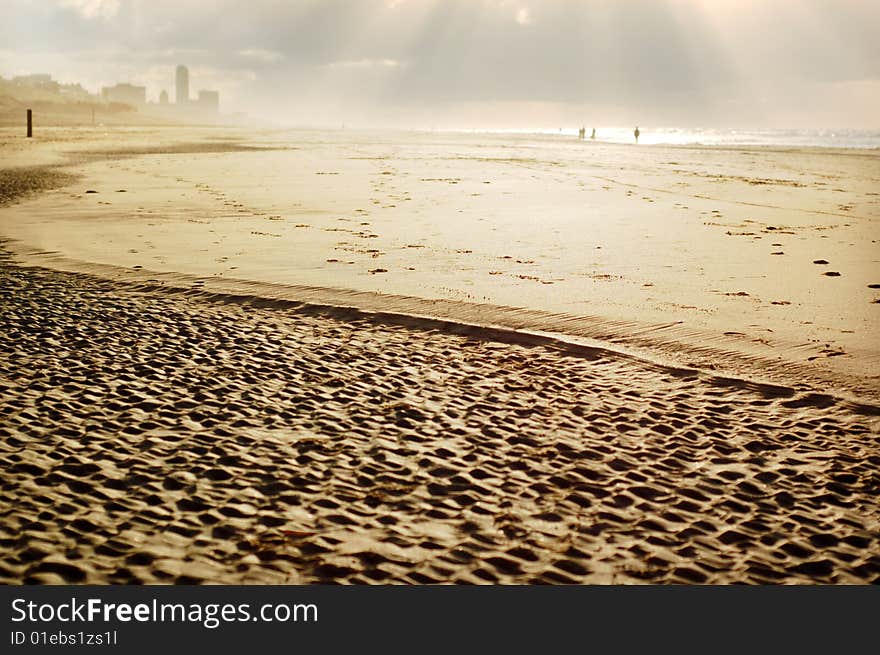 Beach with a texture of sand, narrow of the sunlight as a background. Beach with a texture of sand, narrow of the sunlight as a background.