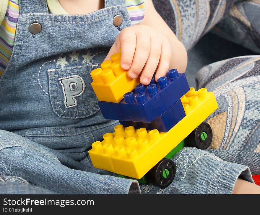 Toy in a hand of the little boy