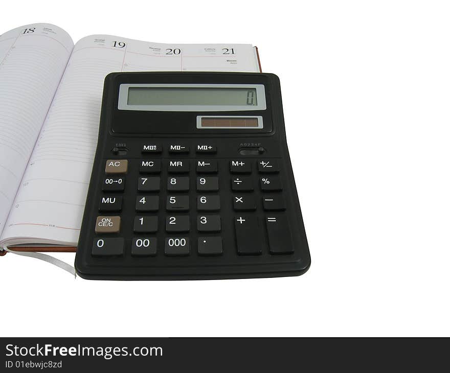 Notebook and calculator in white background