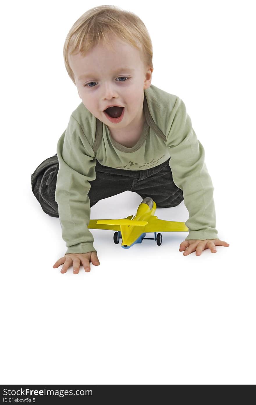 Boy playing with toy on white background. Boy playing with toy on white background