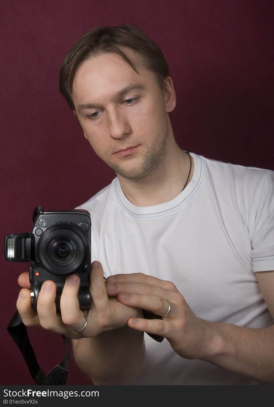 Portrait of a young man on the purple background. Portrait of a young man on the purple background