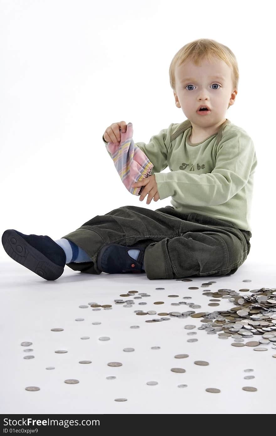 Boy scattered small change on egg white background. Boy scattered small change on egg white background