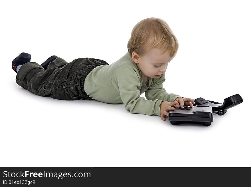 Boy plaies with phone on white background. Boy plaies with phone on white background