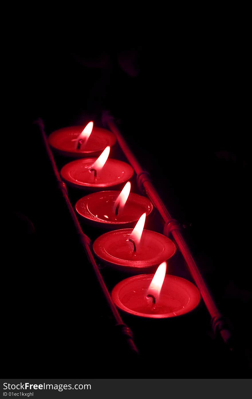 Close up view of the candle cutting through the darkness. Close up view of the candle cutting through the darkness