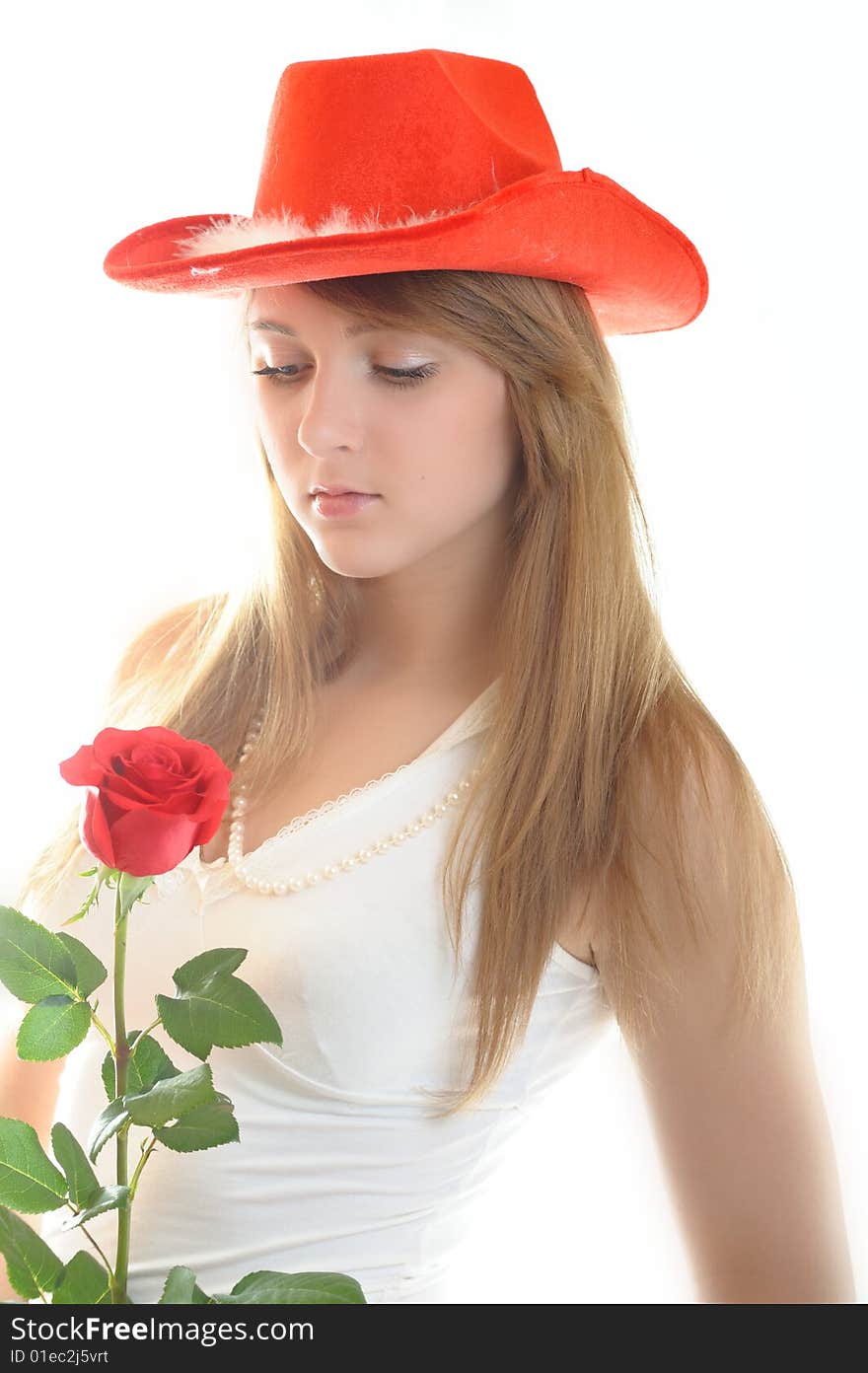 Beautiful young womаn with rose on white background