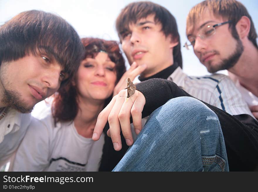 Four friends with butterfly, summer