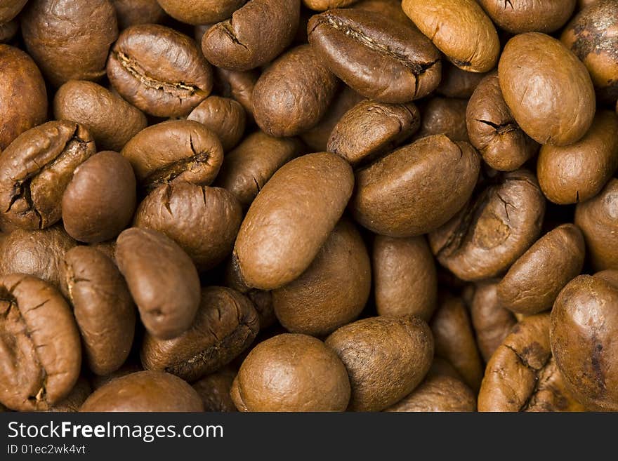 Coffee beans background texture. Macro photo