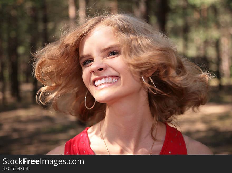 Young Smiling Blonde In Wood