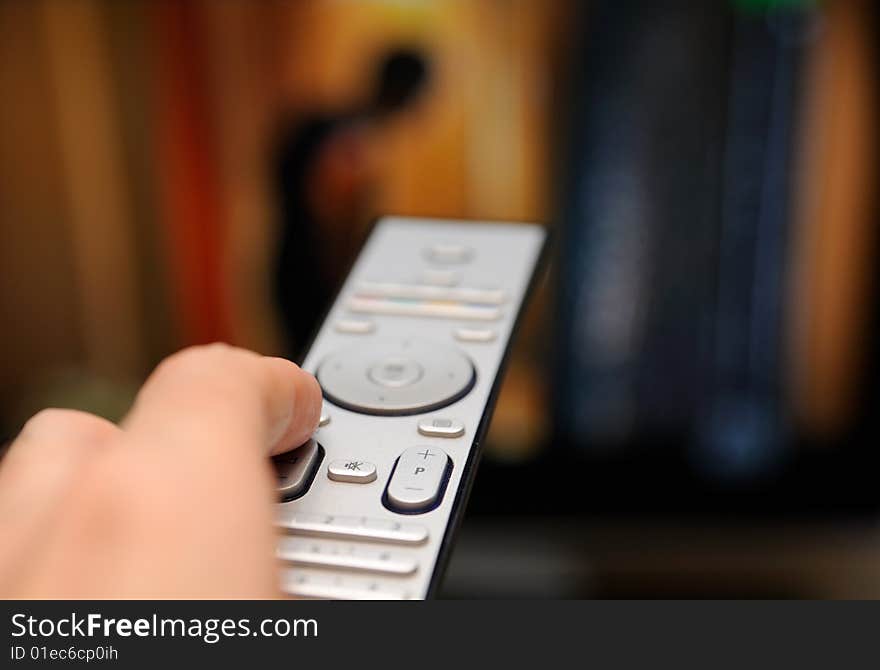 Hand with TV remote control