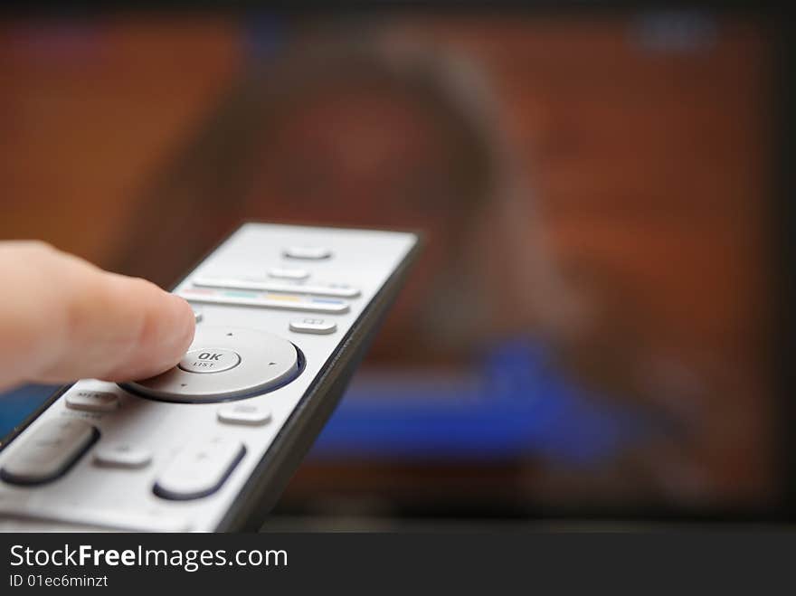 Hand with TV remote control