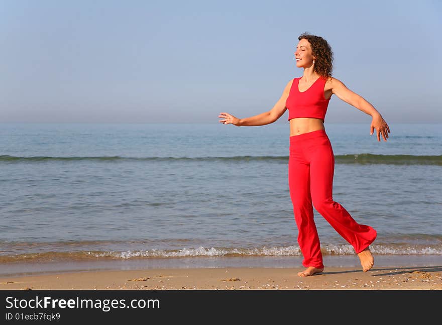 Young woman on shore of sea