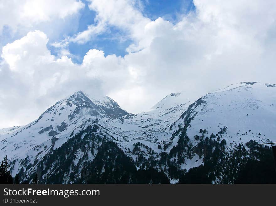 High mountain peak hidden in foggy clouds. High mountain peak hidden in foggy clouds