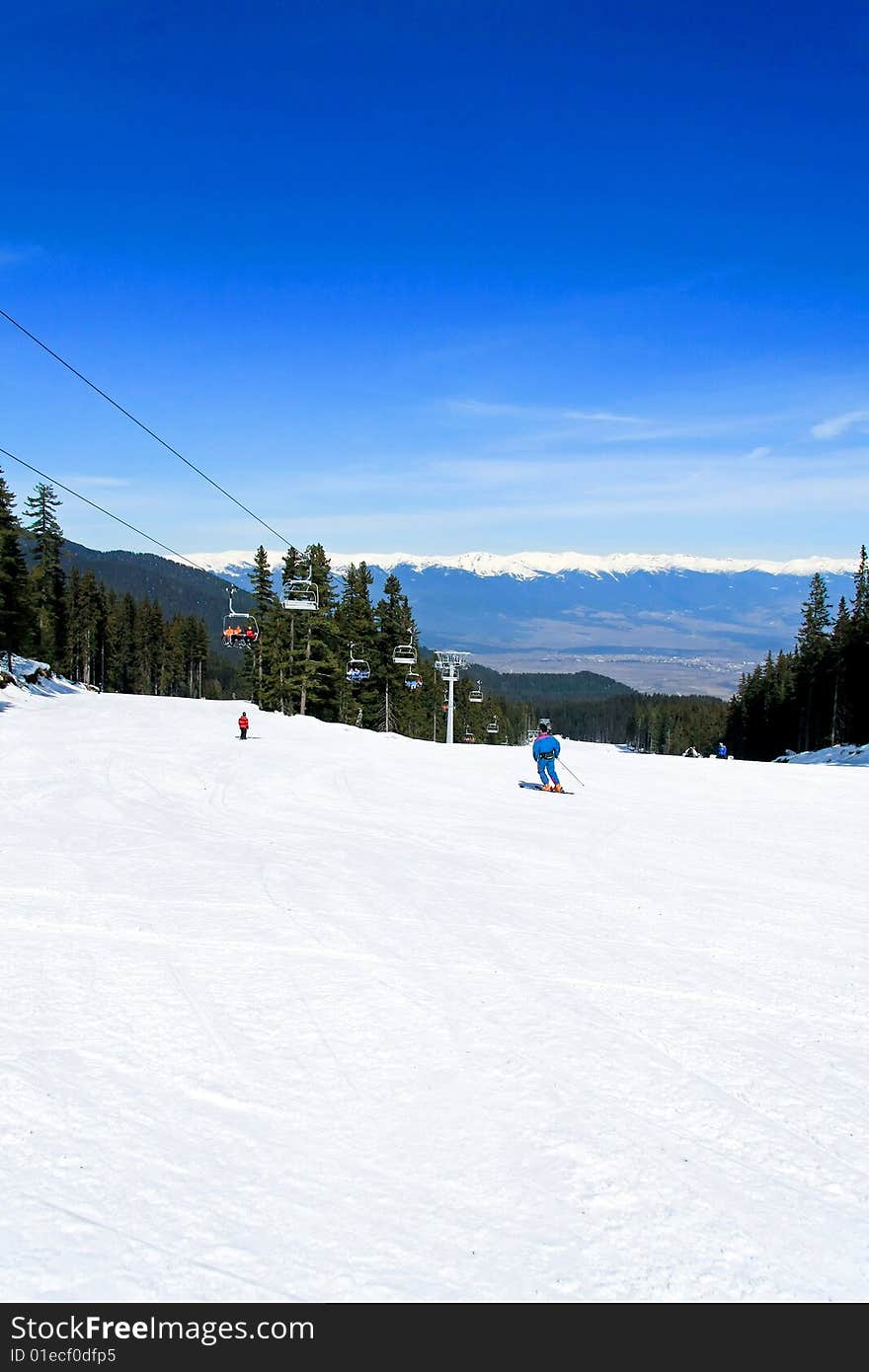 People enjoying skiing on a sunny winter day. People enjoying skiing on a sunny winter day