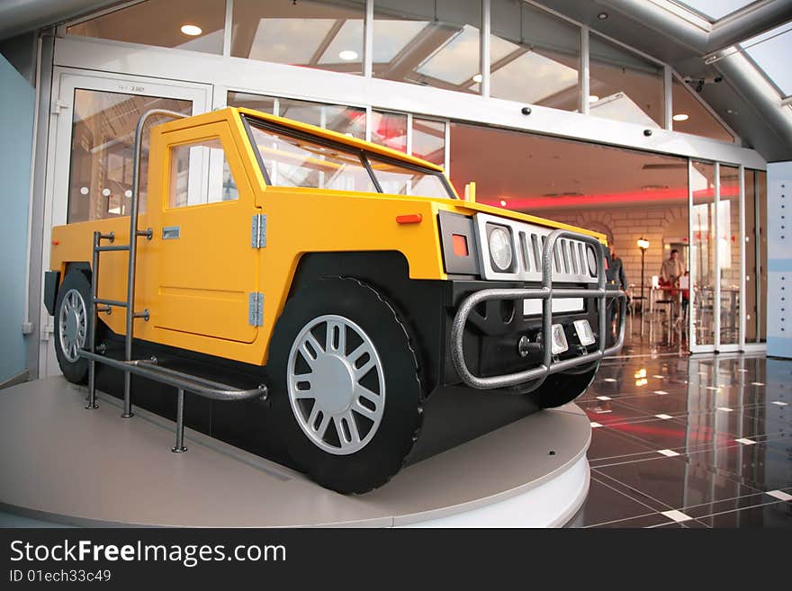 Model of off-road vehicle at  entrance into shopping center