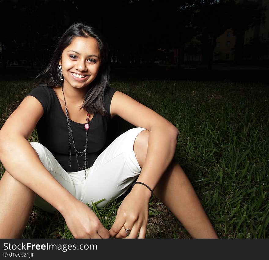 Woman sitting and smiling