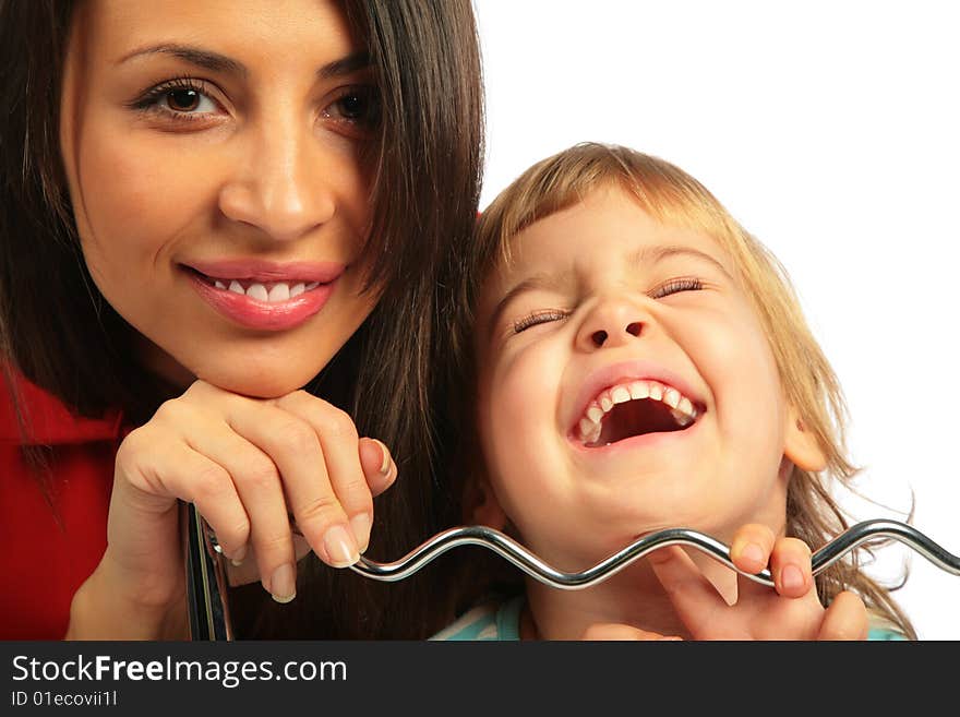 Woman and girl laugh loudly on white