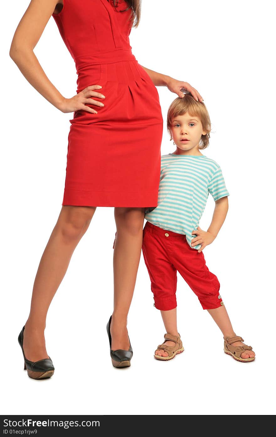 Woman and little girl posing on white