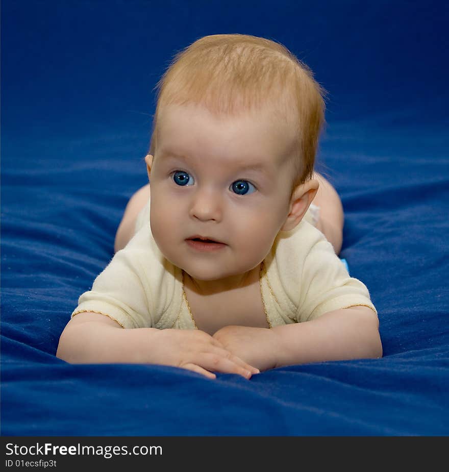 6 months old baby girl in a yellow outfit. 6 months old baby girl in a yellow outfit