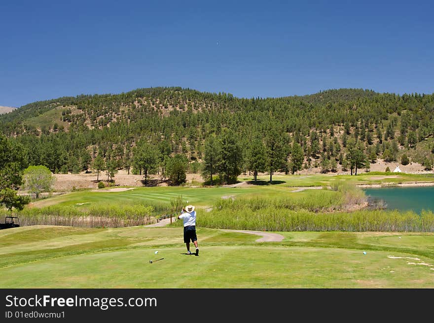 An image of a golfer following through on a swing