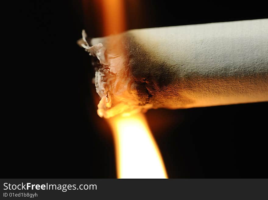 Macro photo of the moment of lighting up a cigarette. Macro photo of the moment of lighting up a cigarette