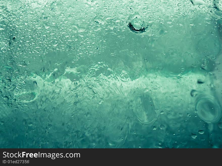 Abstract water-drops on the glass. Abstract water-drops on the glass