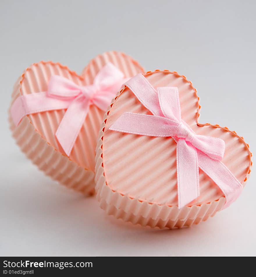 Still life of a pair of heart shaped boxes with ribbons. Still life of a pair of heart shaped boxes with ribbons