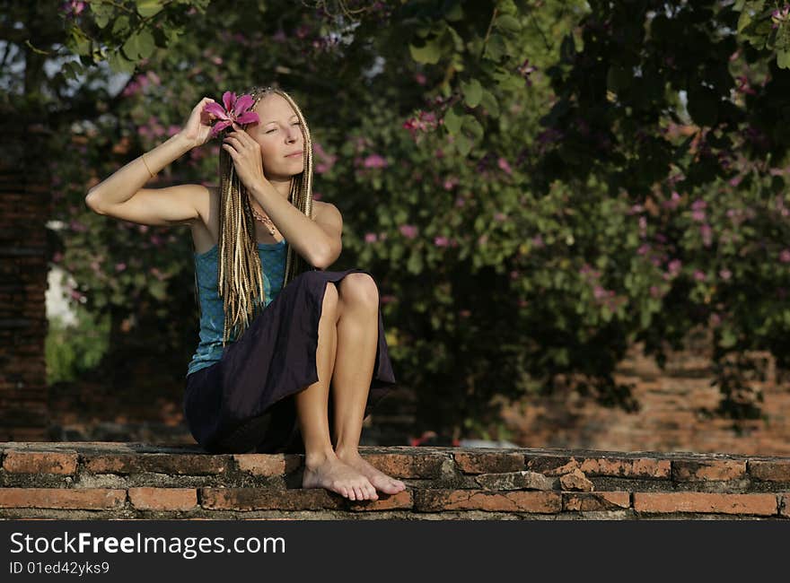 A Young Woman With Tropical Flower