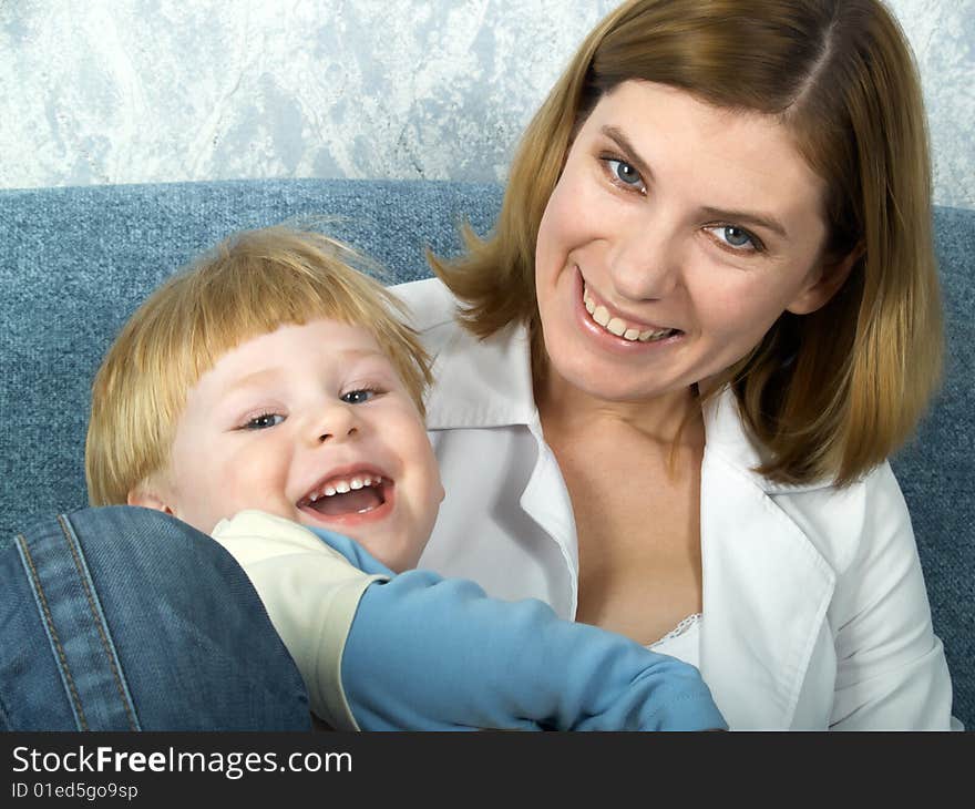 Portrait of young mum with the beautiful small son. Portrait of young mum with the beautiful small son