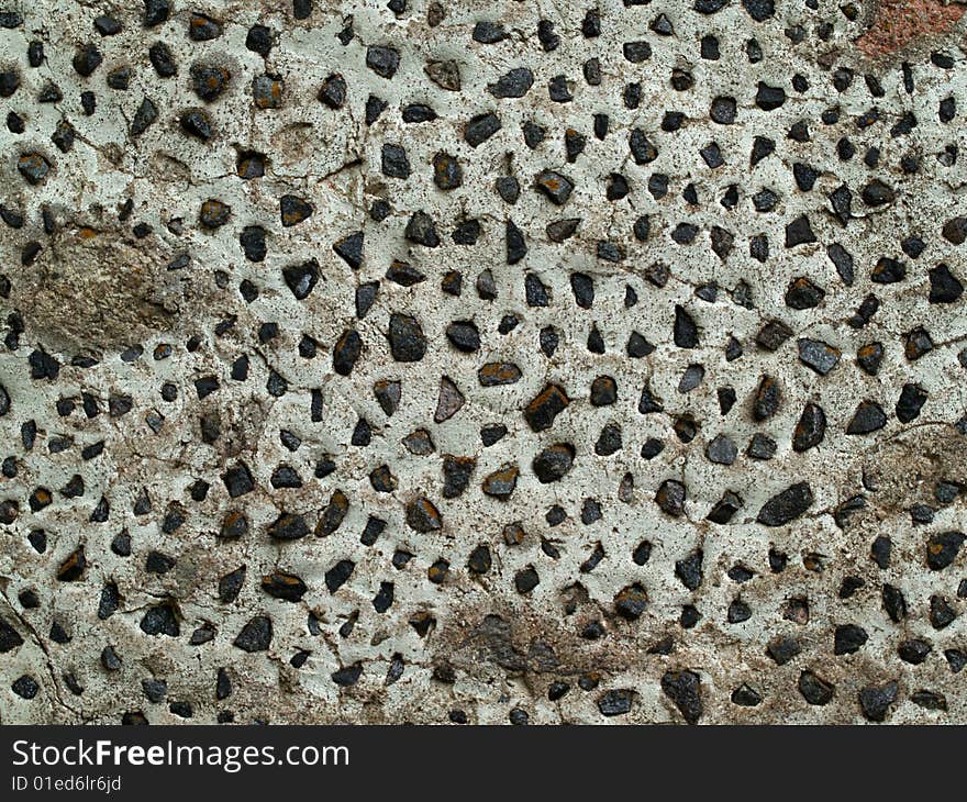 House wall with dark stones inside. House wall with dark stones inside