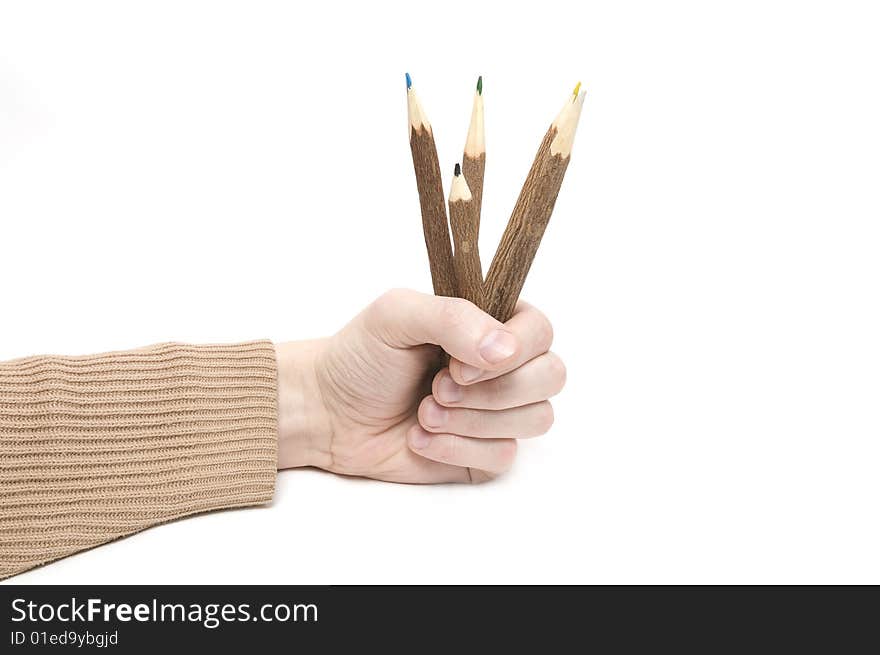 Man's hand with many color pencils on wite background