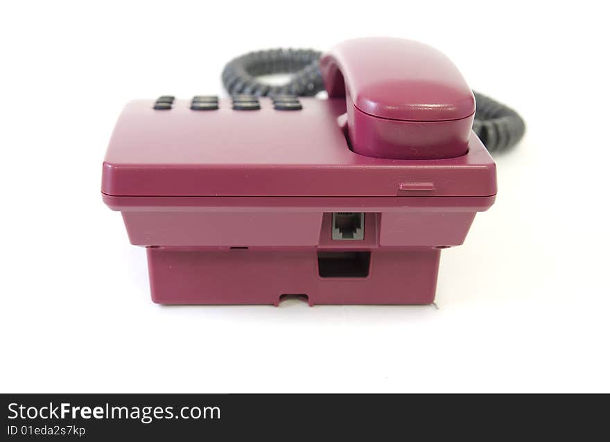 Back side of office red phone isolated on white background. Back side of office red phone isolated on white background