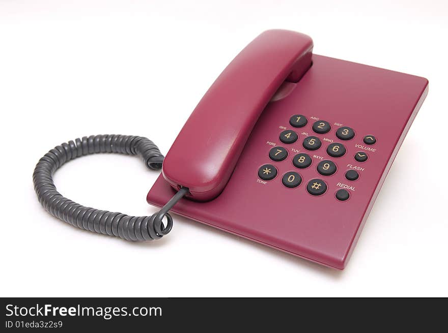 Traditional office red phone isolated on white background. Traditional office red phone isolated on white background