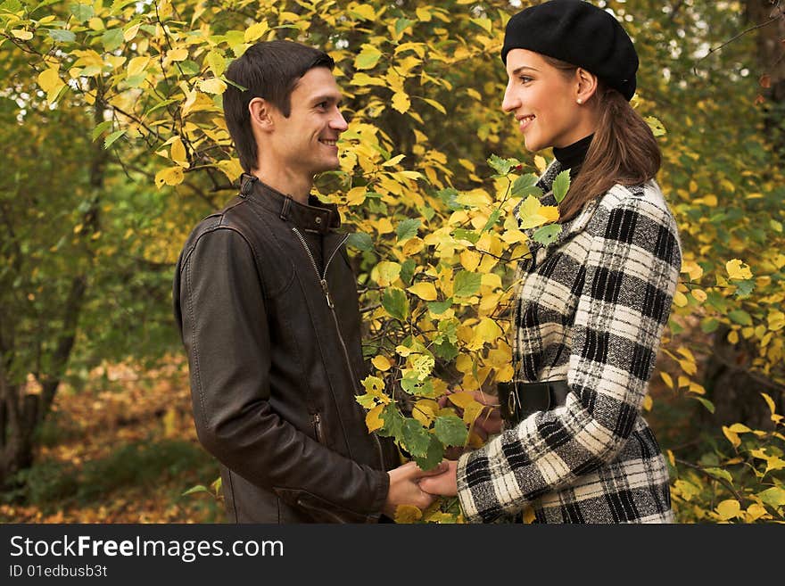 Loving Couple In An Autumnal Park