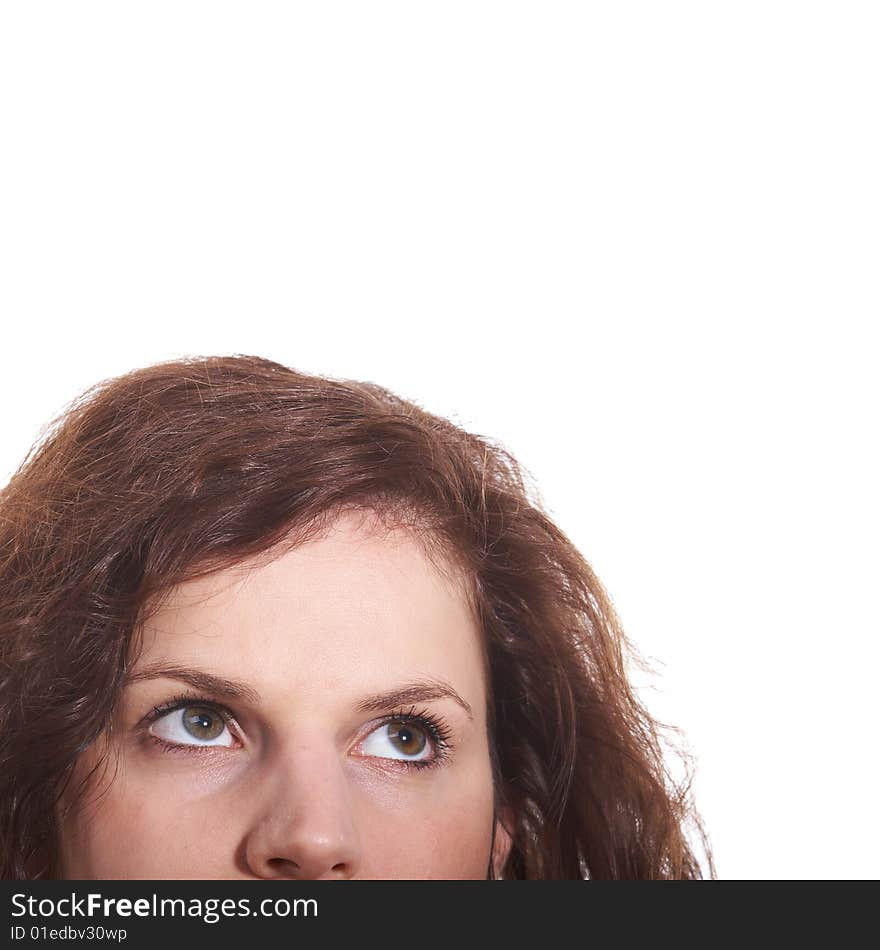 A portrait of a young woman. Looking up into the corner. Lots of copyspace and room for text on this isolate.