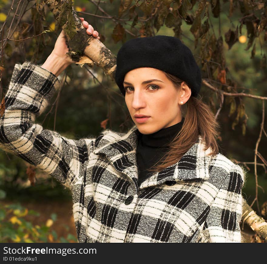 Young woman in autumnal park