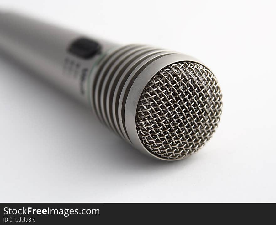 Close-up of wireless microphone on white background.